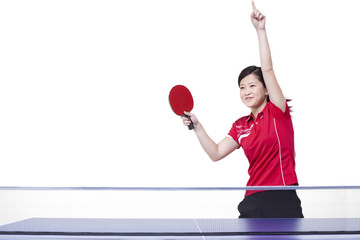 Female table tennis player punching the air