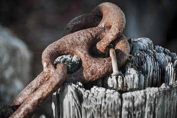 Rusty iron chain railing fragment