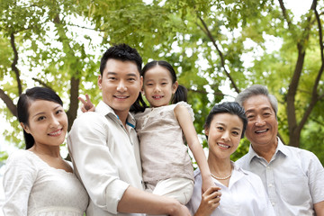 Chinese family with grandparents in a park