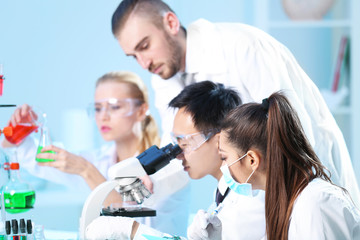 Young medical technicians working in laboratory