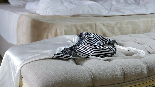 Woman throws erotic nightdress and a black masque