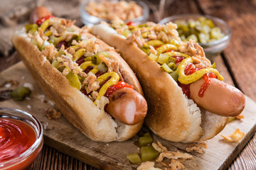 Fresh made Hot Dog with fried onions and cucumbers - obrazy, fototapety, plakaty