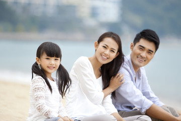 Fototapeta na wymiar Happy family having a good time on the beach of Repulse Bay, Hong Kong