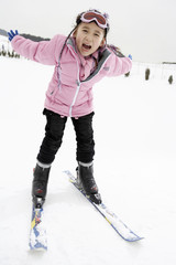 Girl Skiing Down Slope