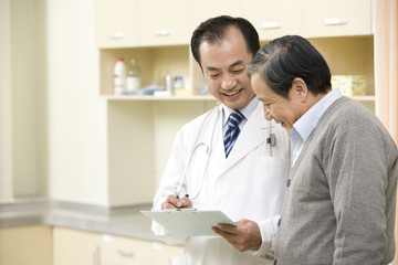 Doctor Shows a Senior Man a Chart