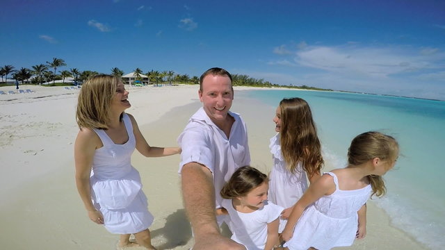 Caucasian family in white clothes filming video selfie 