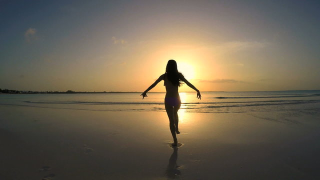 Asian Chinese girl in travel vacation resort at sunset