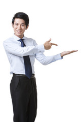 Portrait of a Businessman Pointing at an Empty Object