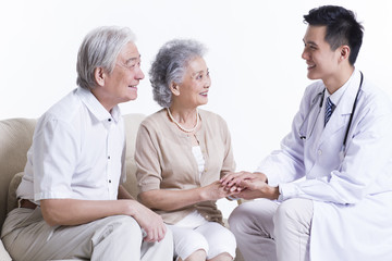 Fototapeta premium Doctor talking with senior couple