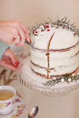 Vintage porcelain tea service with marble winter cake and on glass vintage table. 