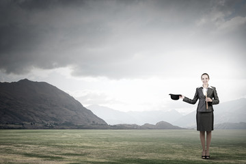 Woman magician with bowler hat
