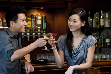 Couple Enjoying Cocktails Together