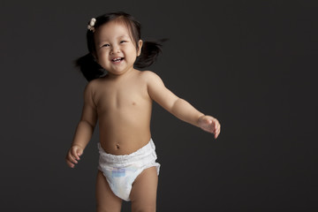 Studio shot of a happy Chinese baby girl