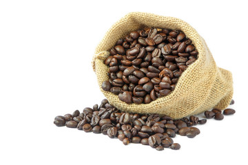 Roasted coffee beans in burlap sack on white background.