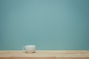 vintage tone of coffee cup on wood background