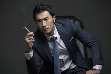 Confident businessman with cigar