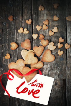 Cookies in Shape of Hearts for Valentine's Day. Message With Love
