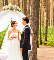 Couple Getting Married at an Outdoor Wedding Ceremony