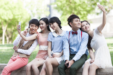 Stylish young people sitting together