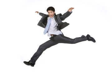 Young businessman jumping in mid-air