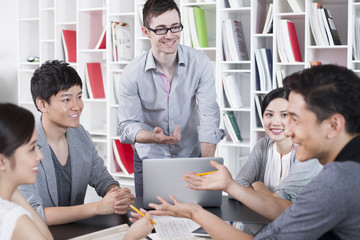 Young office workers holding a meeting
