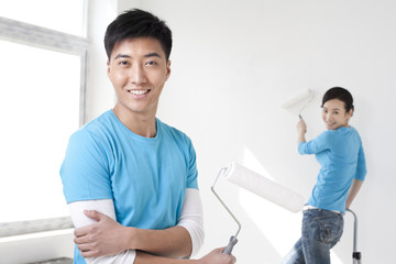 Fototapeta premium Portrait of a happy man and his girlfriend in the background
