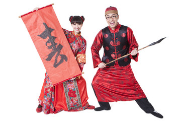 Happy couple in Tang suit practicing calligraphy