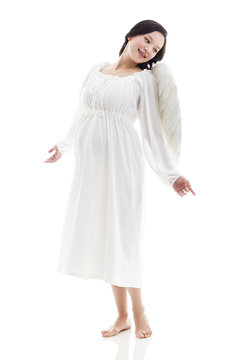 Pregnant woman wearing angel wings