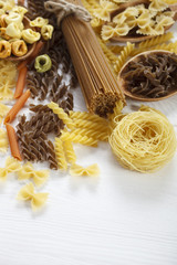 A set of raw pasta on a wooden table