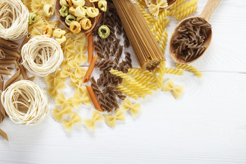 A set of raw pasta on a wooden table