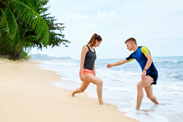 Athletics. Fit Couple Stretching, Exercising On Beach. Sports, F
