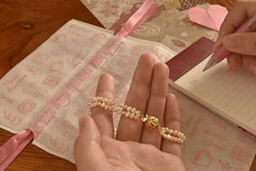 Bracelet of pearl, writing letter on Valentines