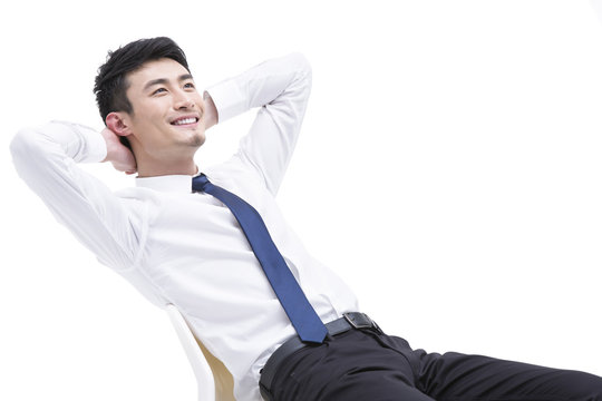 Young businessman resting in chair