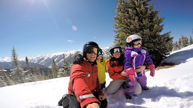 selfie portrait Caucasian family snow skiing parents children healthy lifestyle