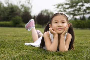 Young Girl Laying In Park