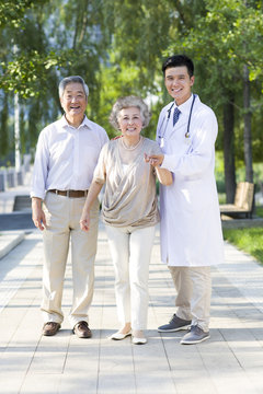 Cheerful doctor with seniors