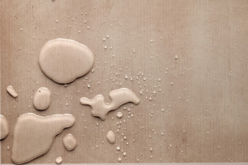 splash drops on carton piece of paper
