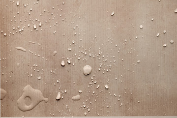 splash drops on carton piece of paper
