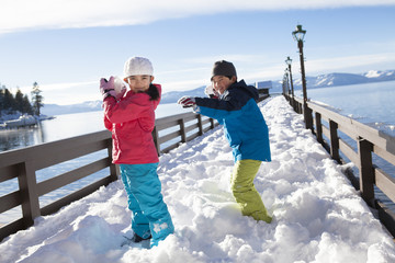 Boy and girl having a snowball fight © Blue Jean Images