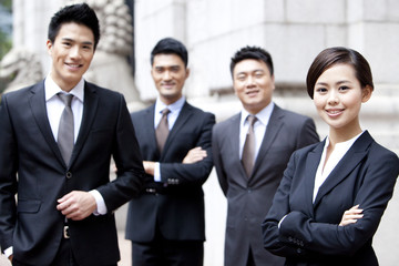 Portrait of confident business team outside a building, Hong Kong