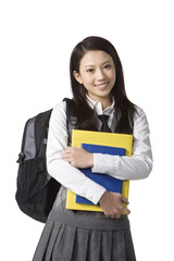 Schoolgirl holding her books