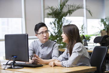 IT workers talking in office