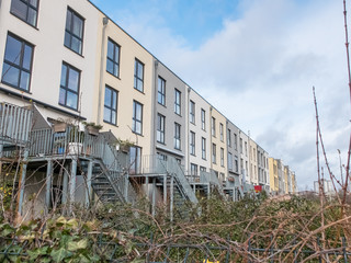 Modern Townhouses with Wooden Decks in Back Yards