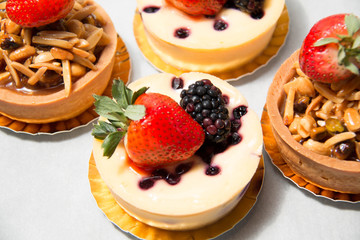 almond nut tart on top fresh strawberry and blueberry cheese