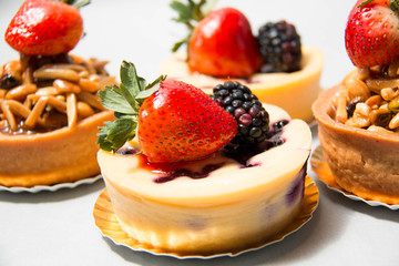 almond nut tart on top fresh strawberry and blueberry cheese