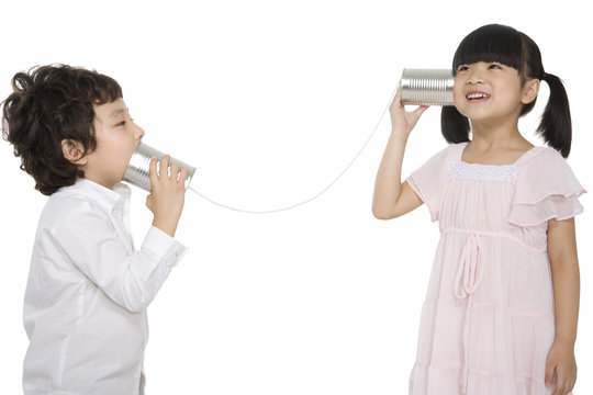 Kids playing with a tin-phone