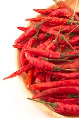 red hot chili peppers isolated on wooden plates and isolated bac