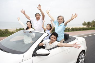 Happy Family Driving in a Convertible