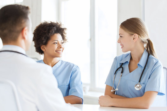 group of happy doctors meeting at hospital office