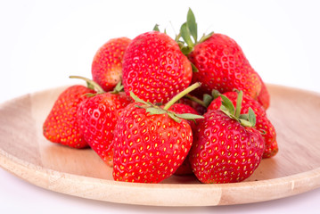 strawberries close up on a plate with white background